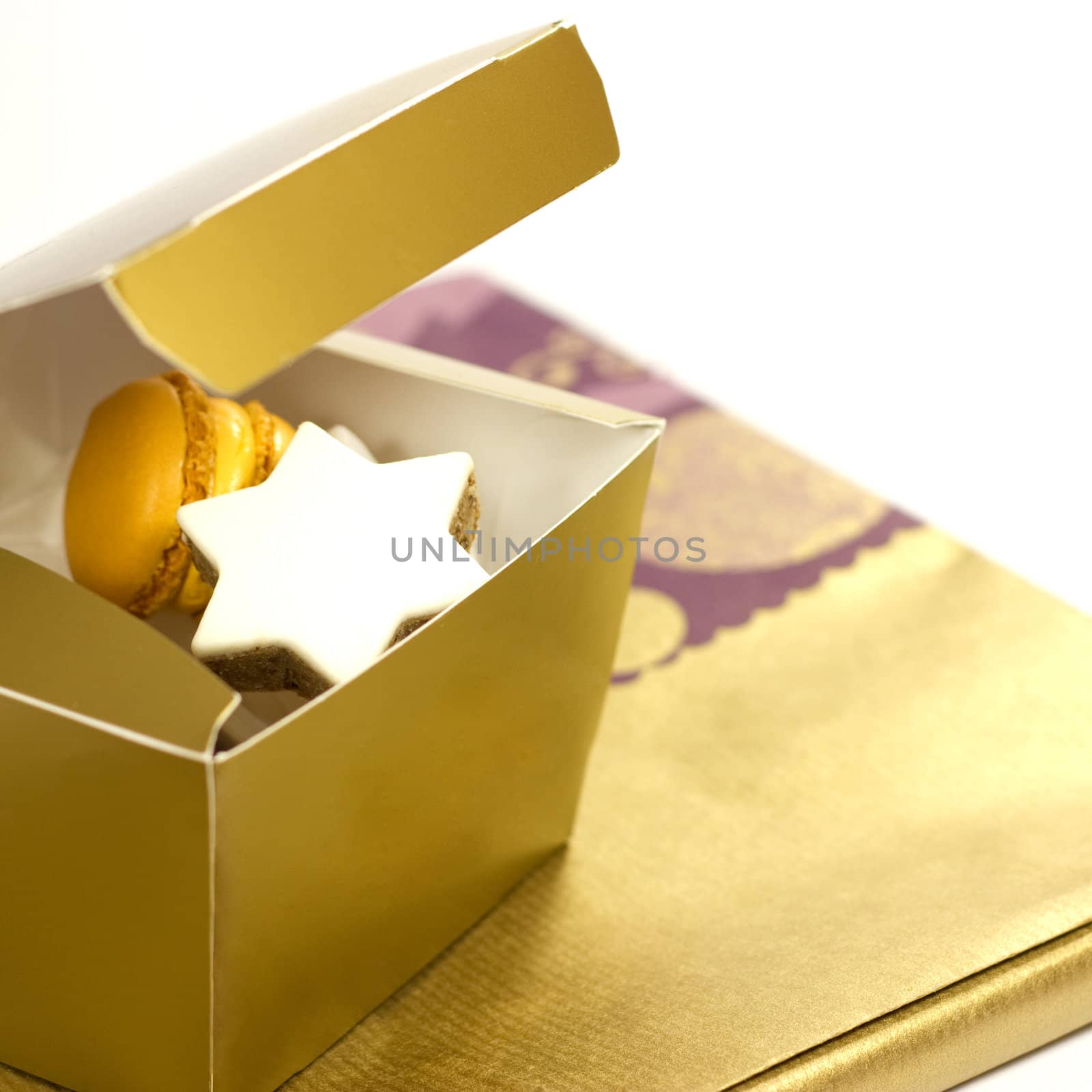 Cookies in a present box on decoration on a white background