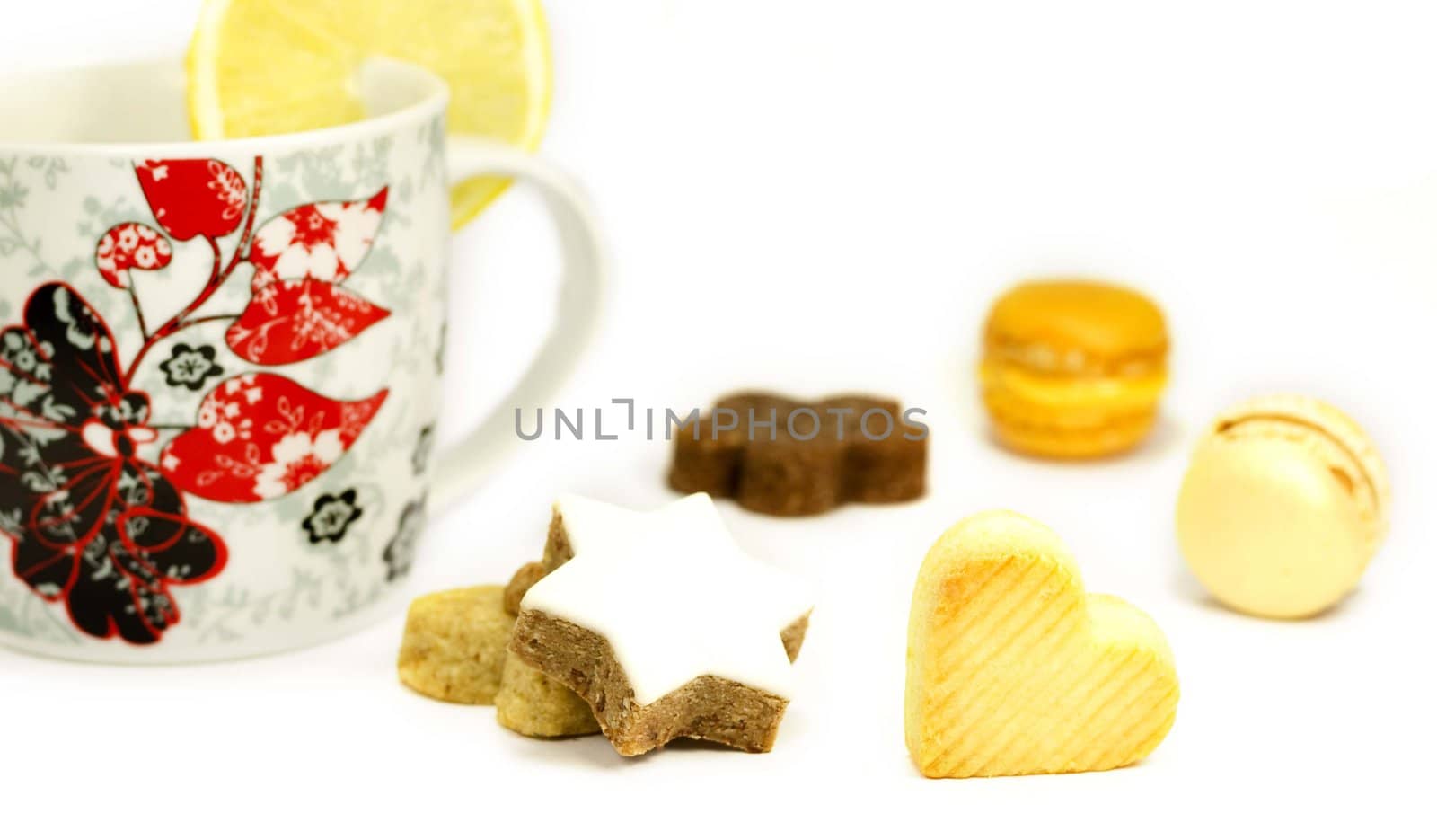 Cookies and mug with lemon on a white background