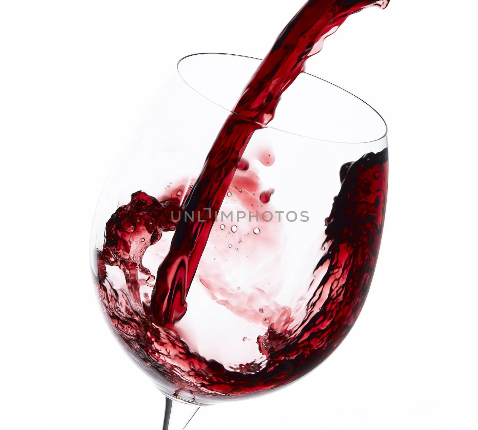 Pouring red wine to wien glass 