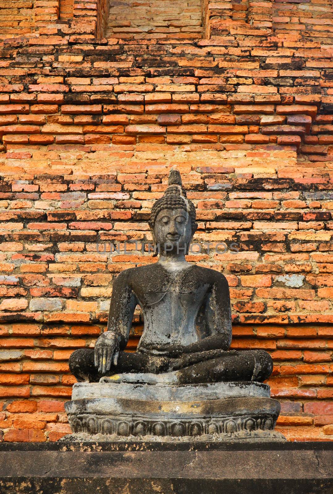 Ancient buddha in Sukhothai historical park, Thailand by nuchylee