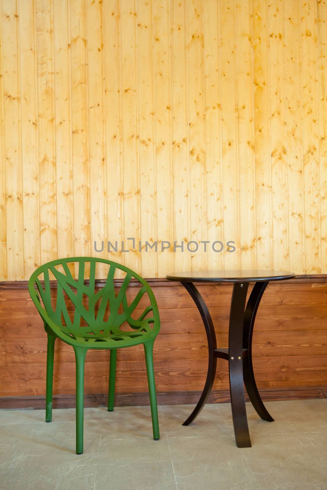 Classic interior with chair and wood wall