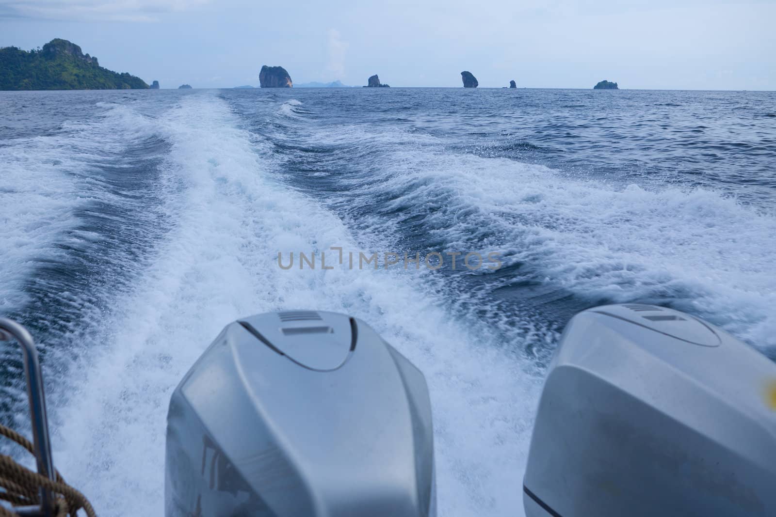 speedy boat prop wash, white wake on the blue ocean sea