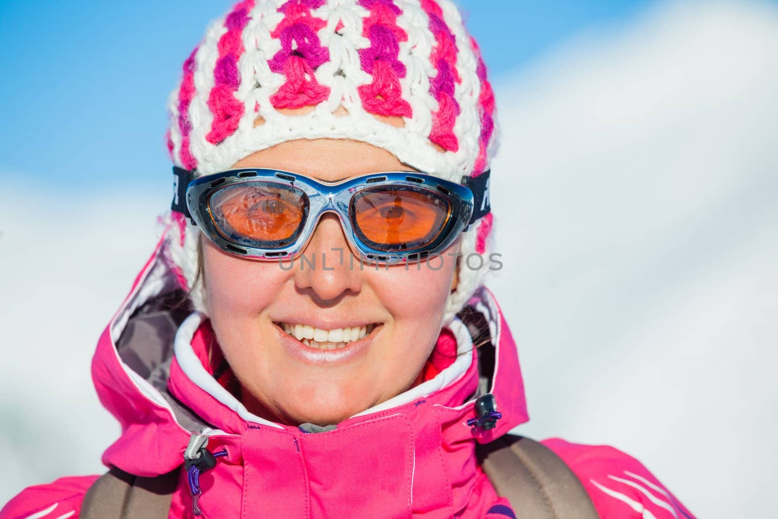 Portrait of young woman a ski outfit at winter outdoor in the Zillertal Arena, Austria