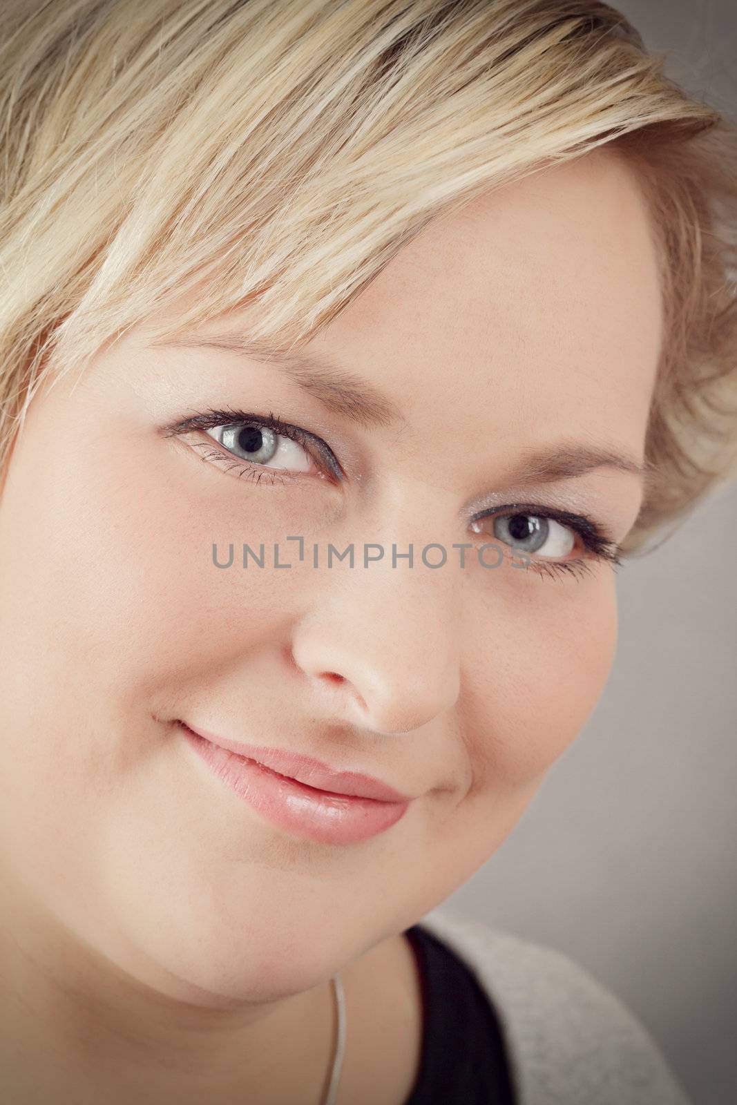 Portrait of cute smiling relaxing plump woman