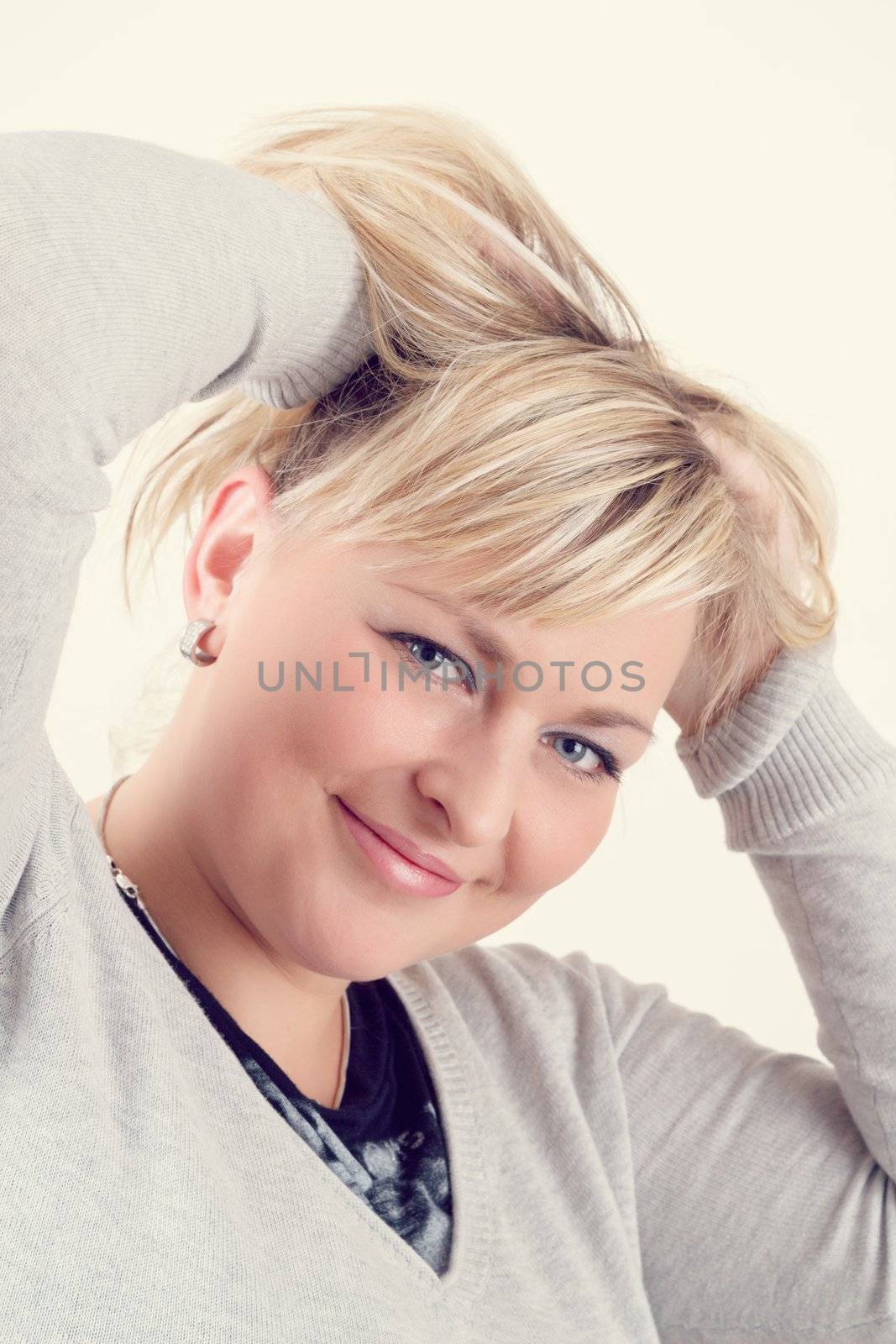 Portrait of cute smiling relaxing plump woman