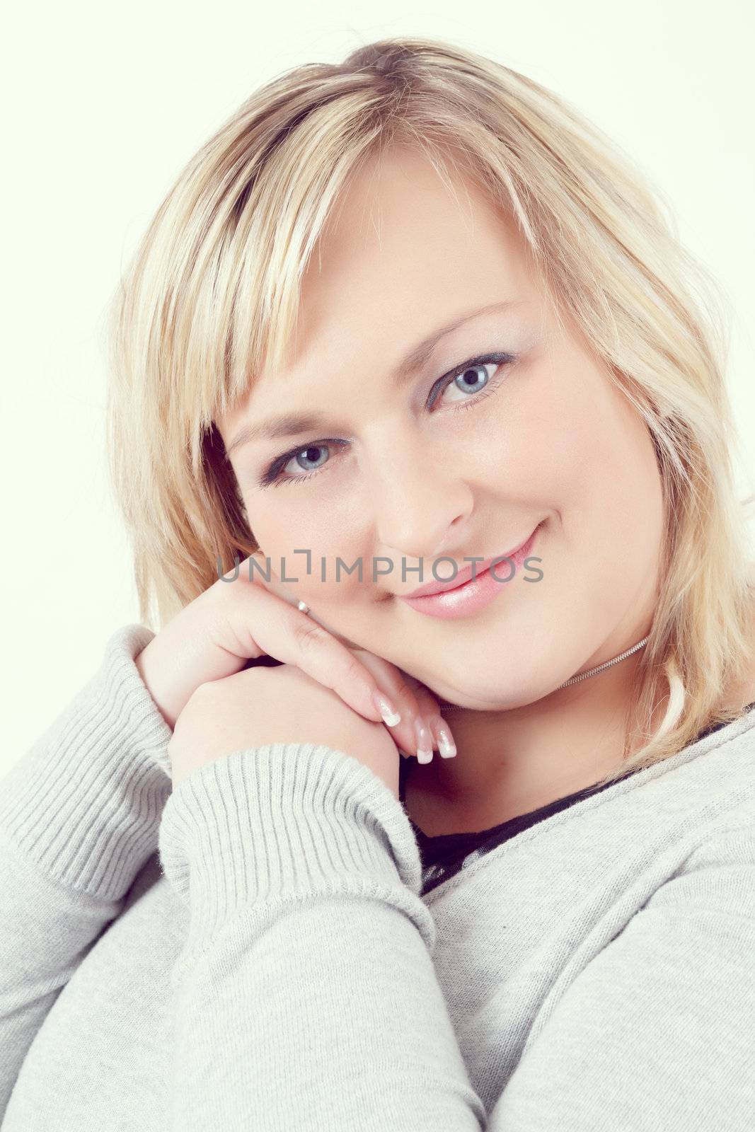 Portrait of cute smiling relaxing plump woman