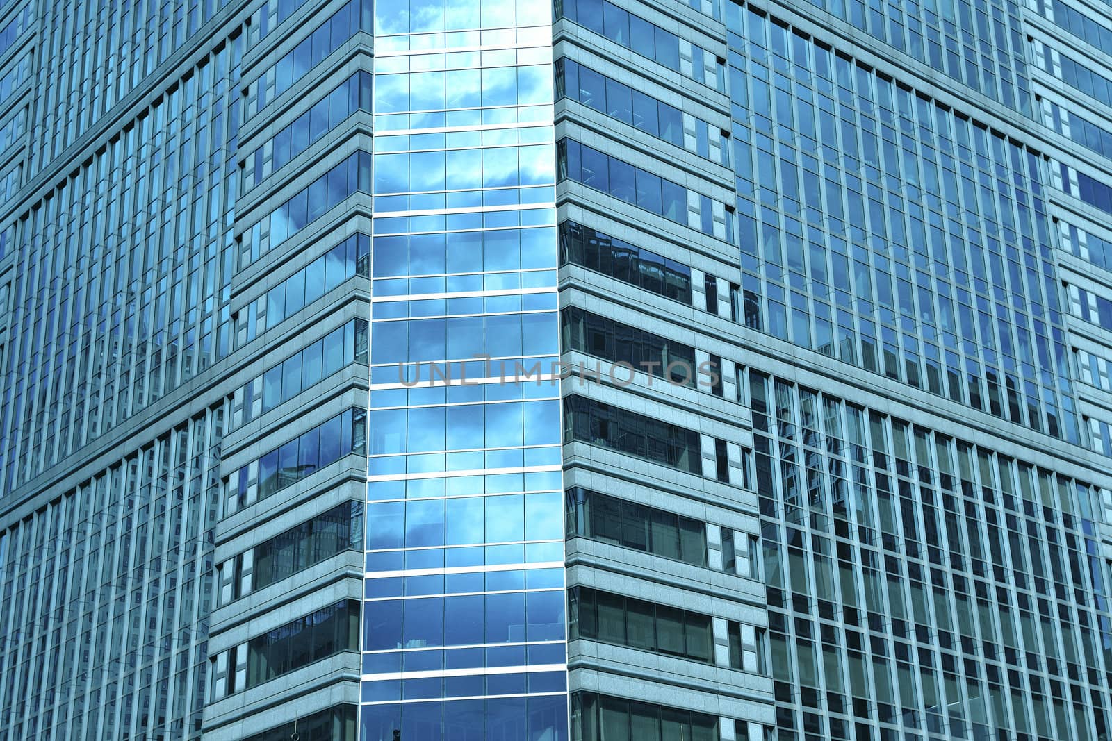 modern skyscraper office building pattern with sky reflection in windows