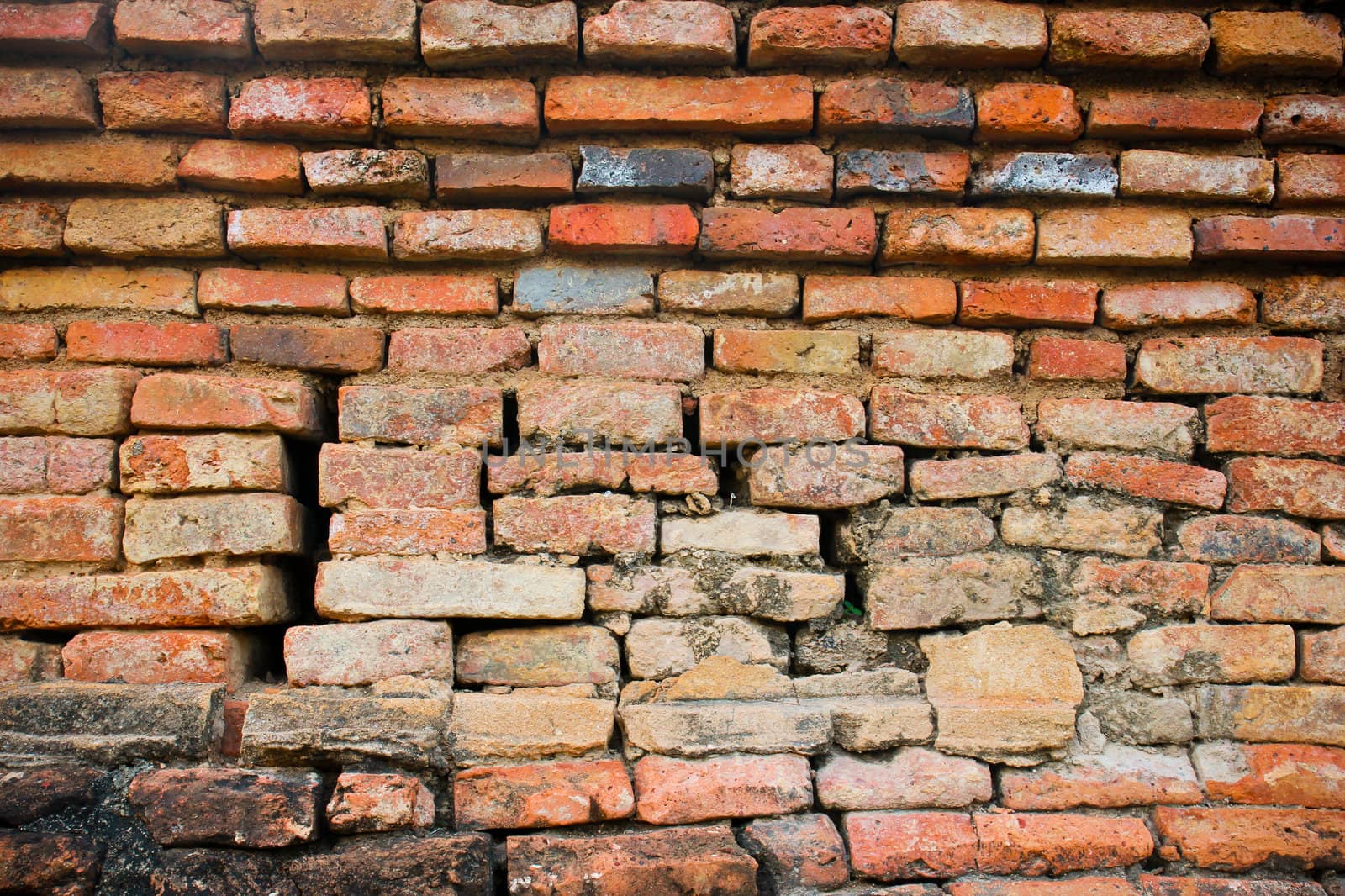 Destroyed brick wall for background