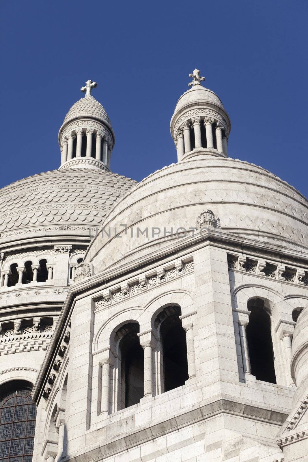 Basilica of the Sacre Coeur in Montmartre Paris under pure blue sky