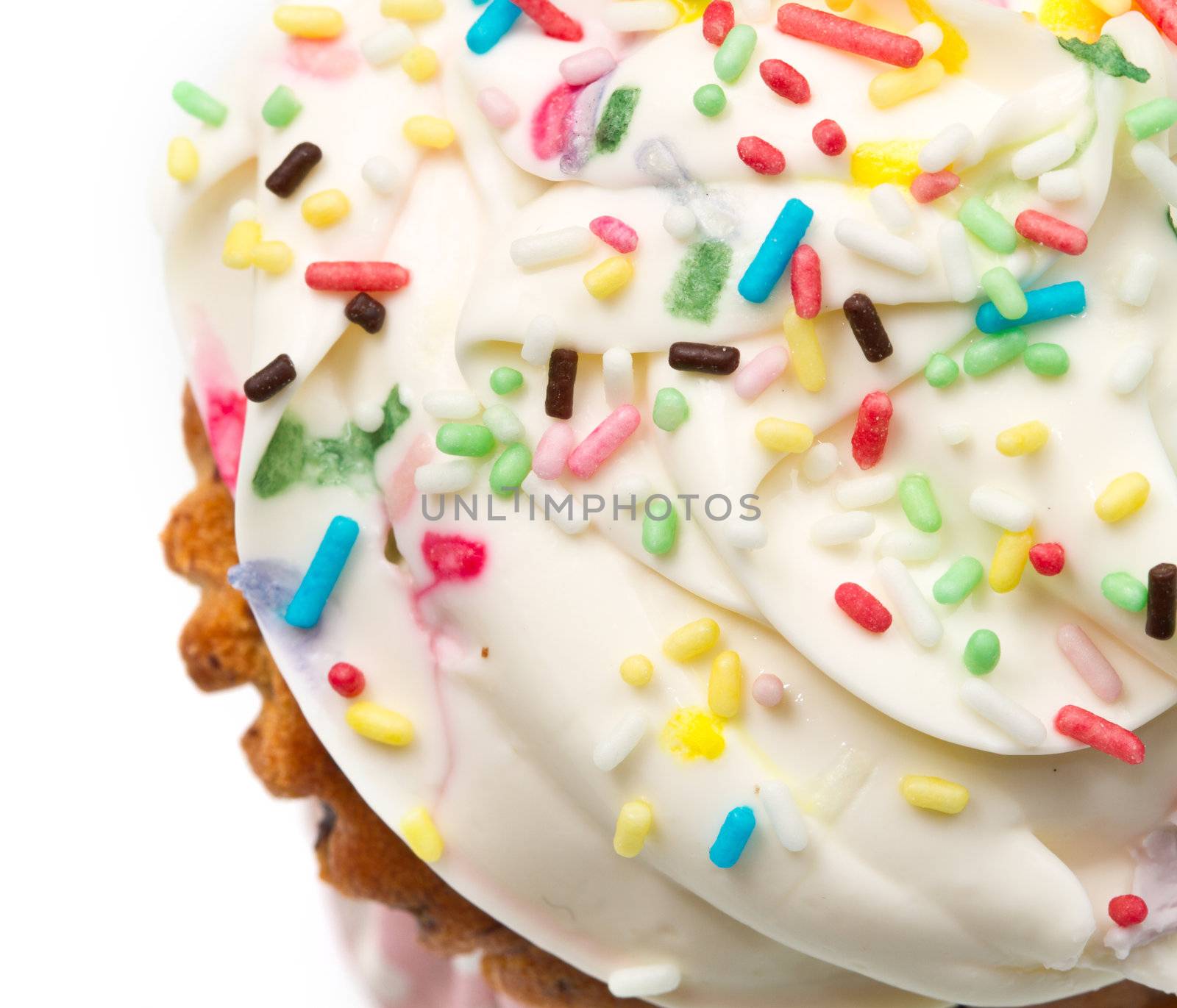  freshly baked vanilla cupcakes with lemon buttercream and sprinkles 