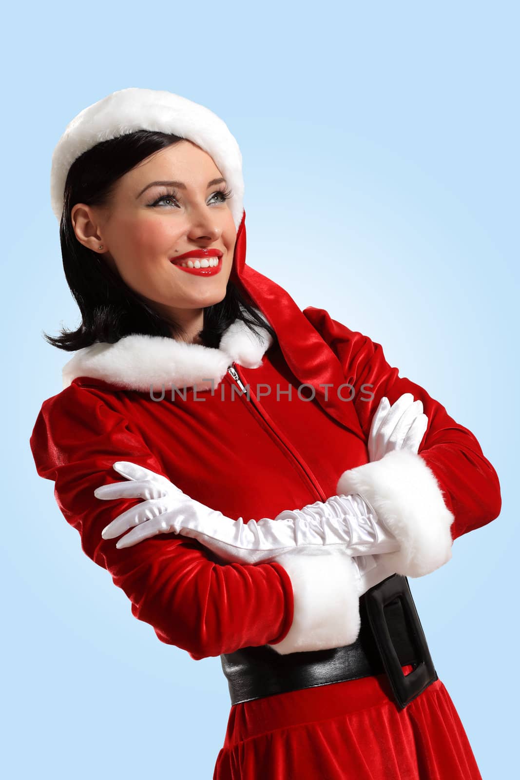 Portrait of beautiful young woman wearing santa claus clothes