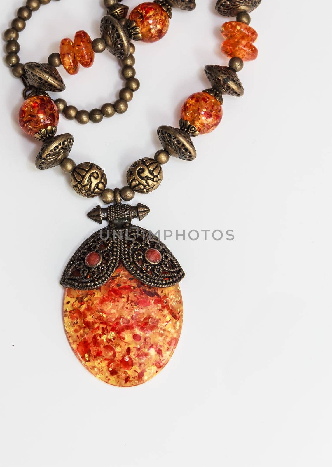 Vintage amber pendant on white background