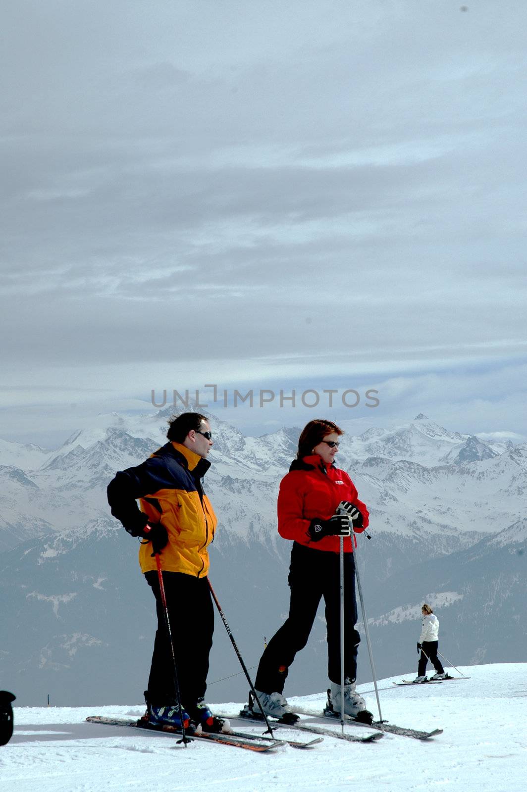 Skiers at mountain top by Alenmax