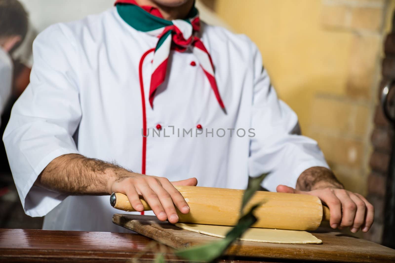 Cook rolls out the dough on a board, the traditional cooking