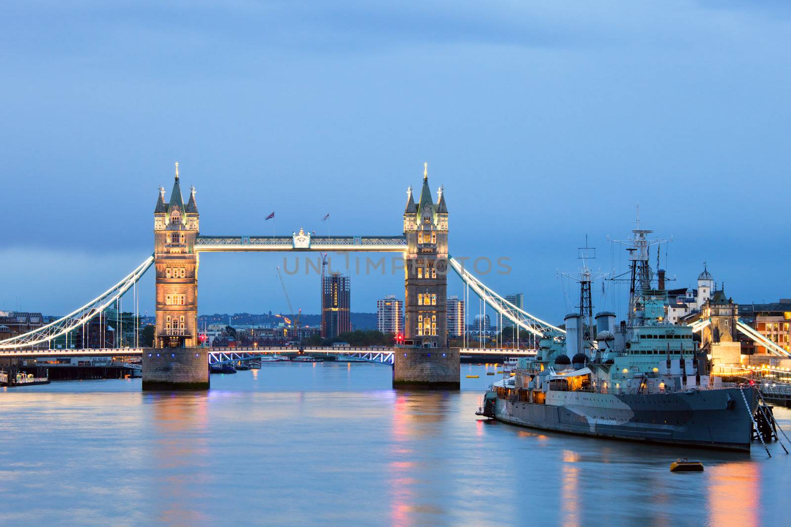 London cityscape with Tower Bridge and HMS Belfast at dusk