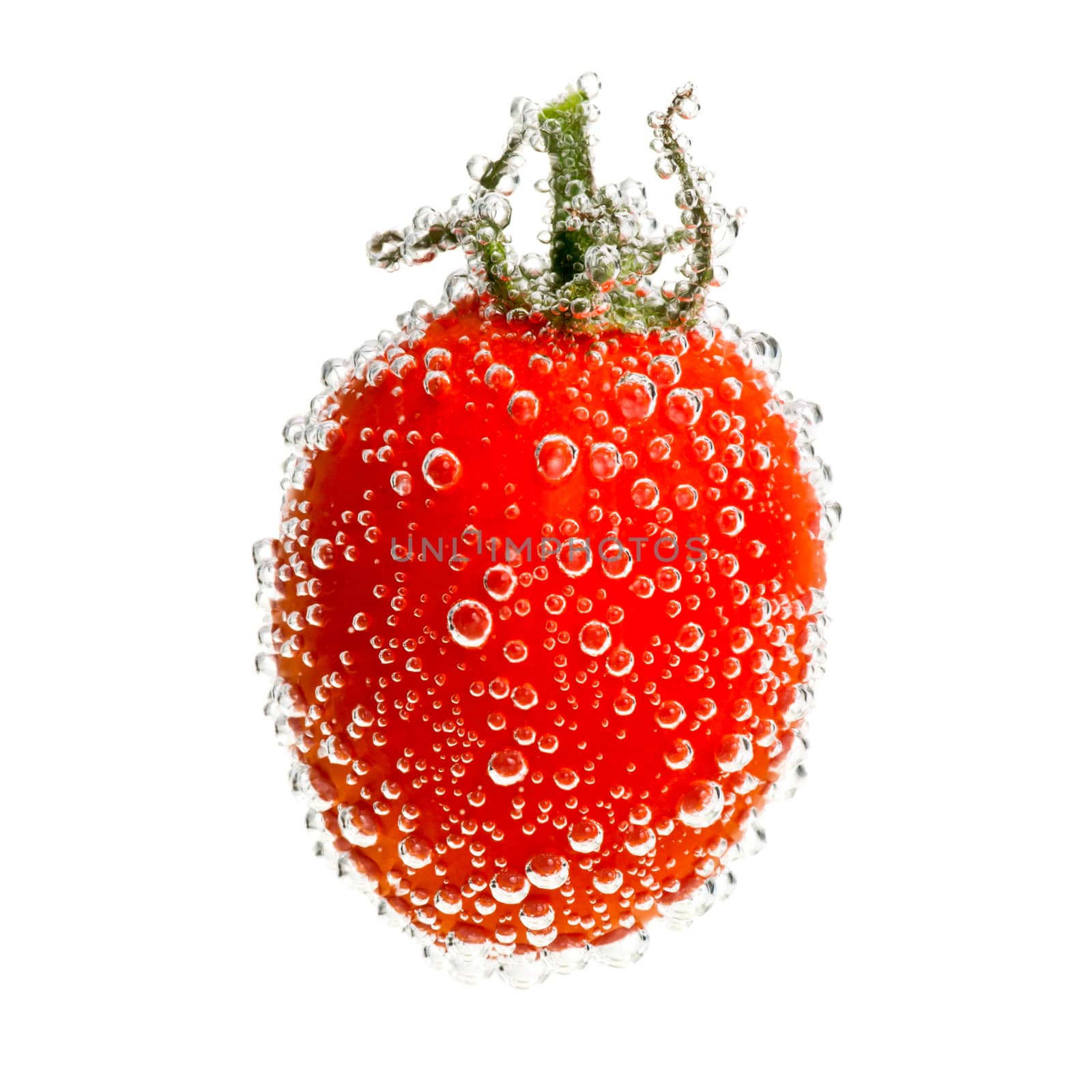 Cherry tomato in water with bubbles on white background