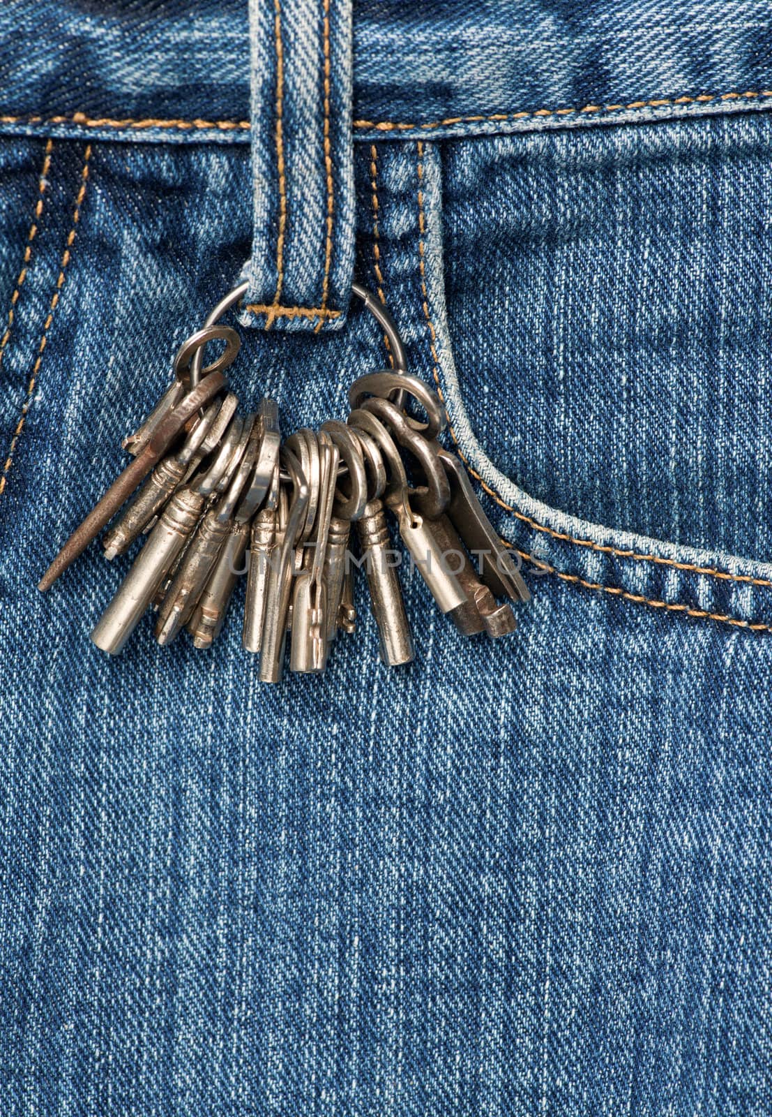 Bunch of keys on a blue jeans