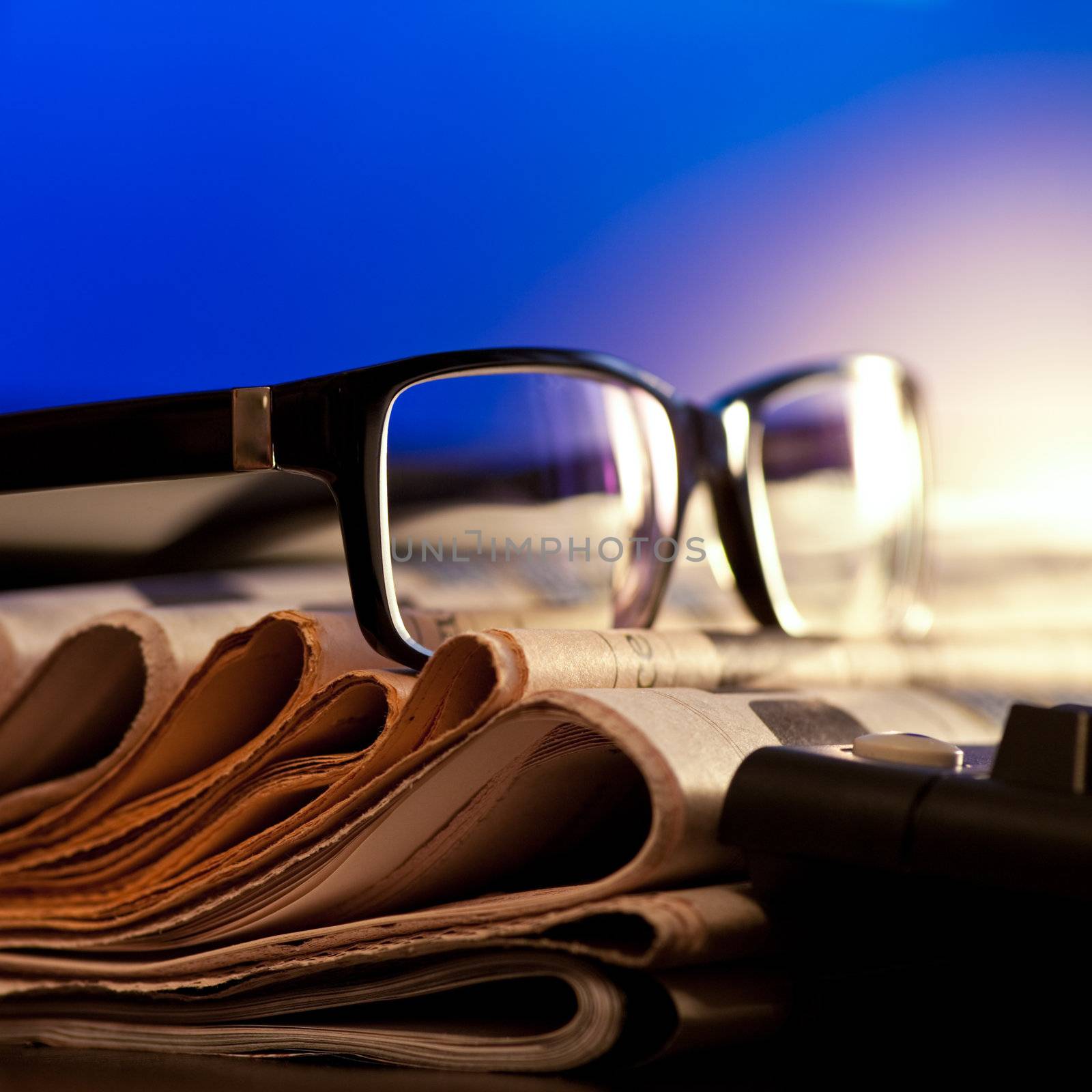 Glasses on newspapers by naumoid