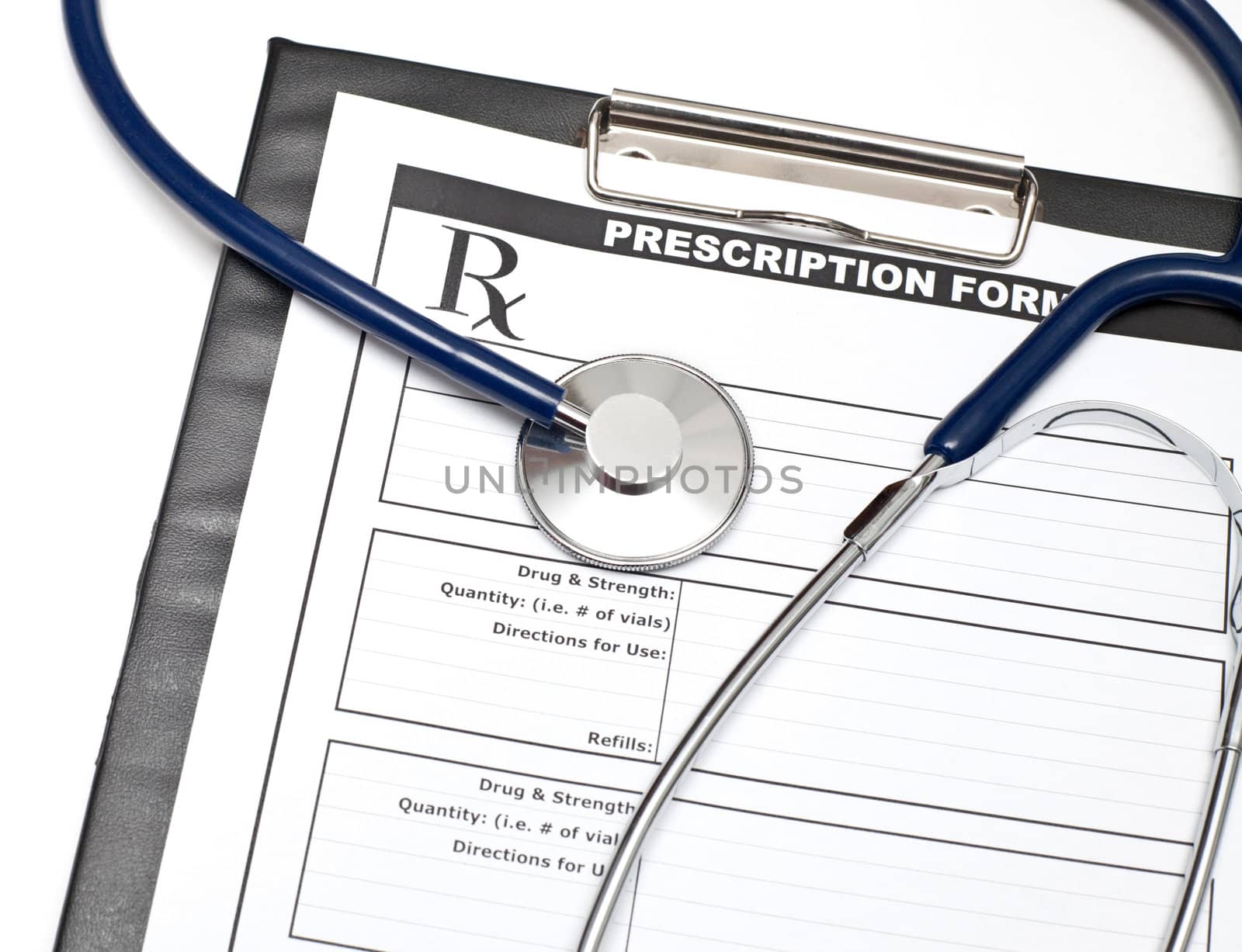 Blank prescription form on clipboard with stethoscope