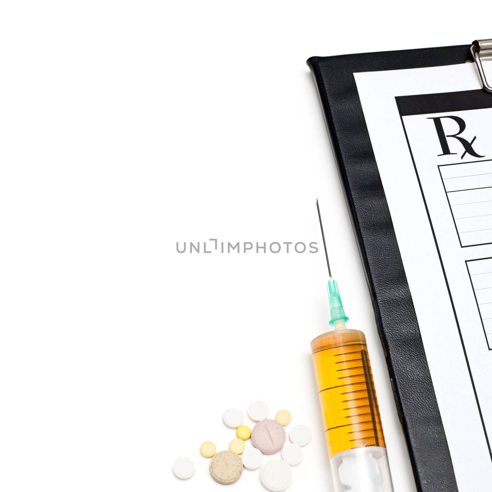 Pills syringe and clipboard on white background