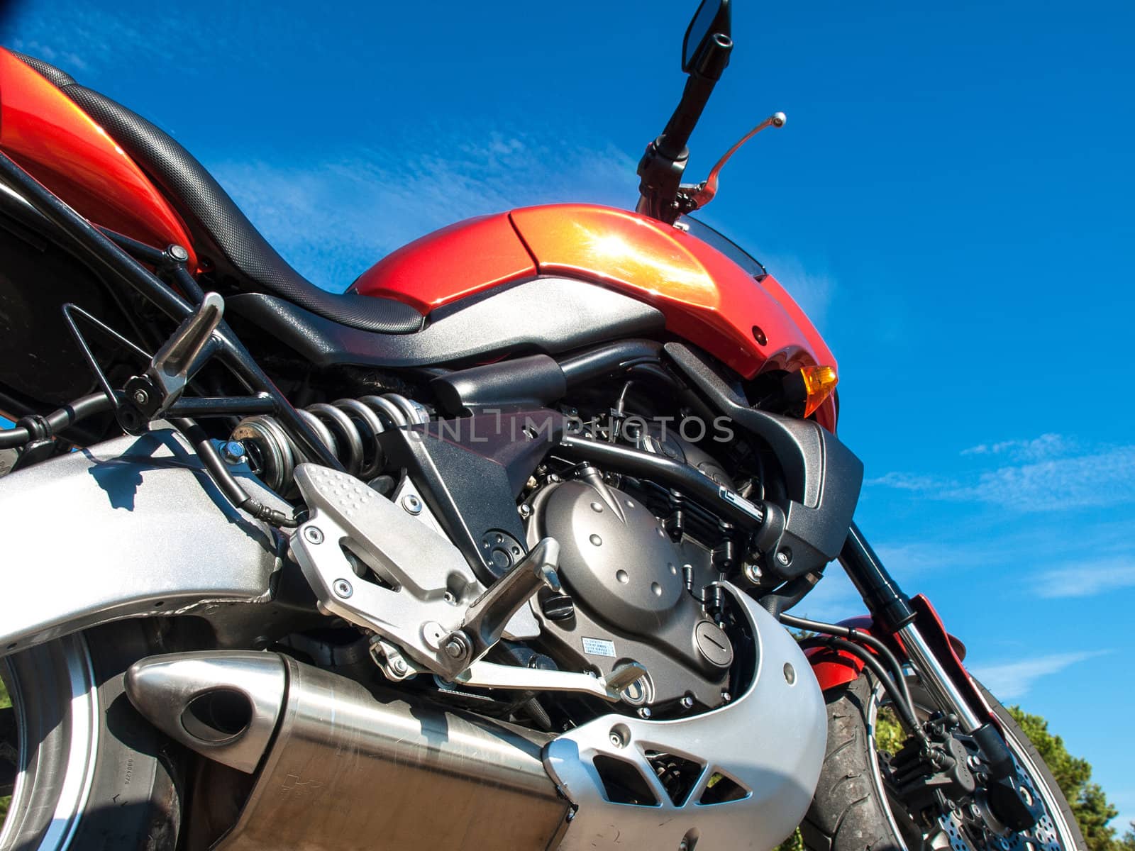 engine of a orange motorbike 