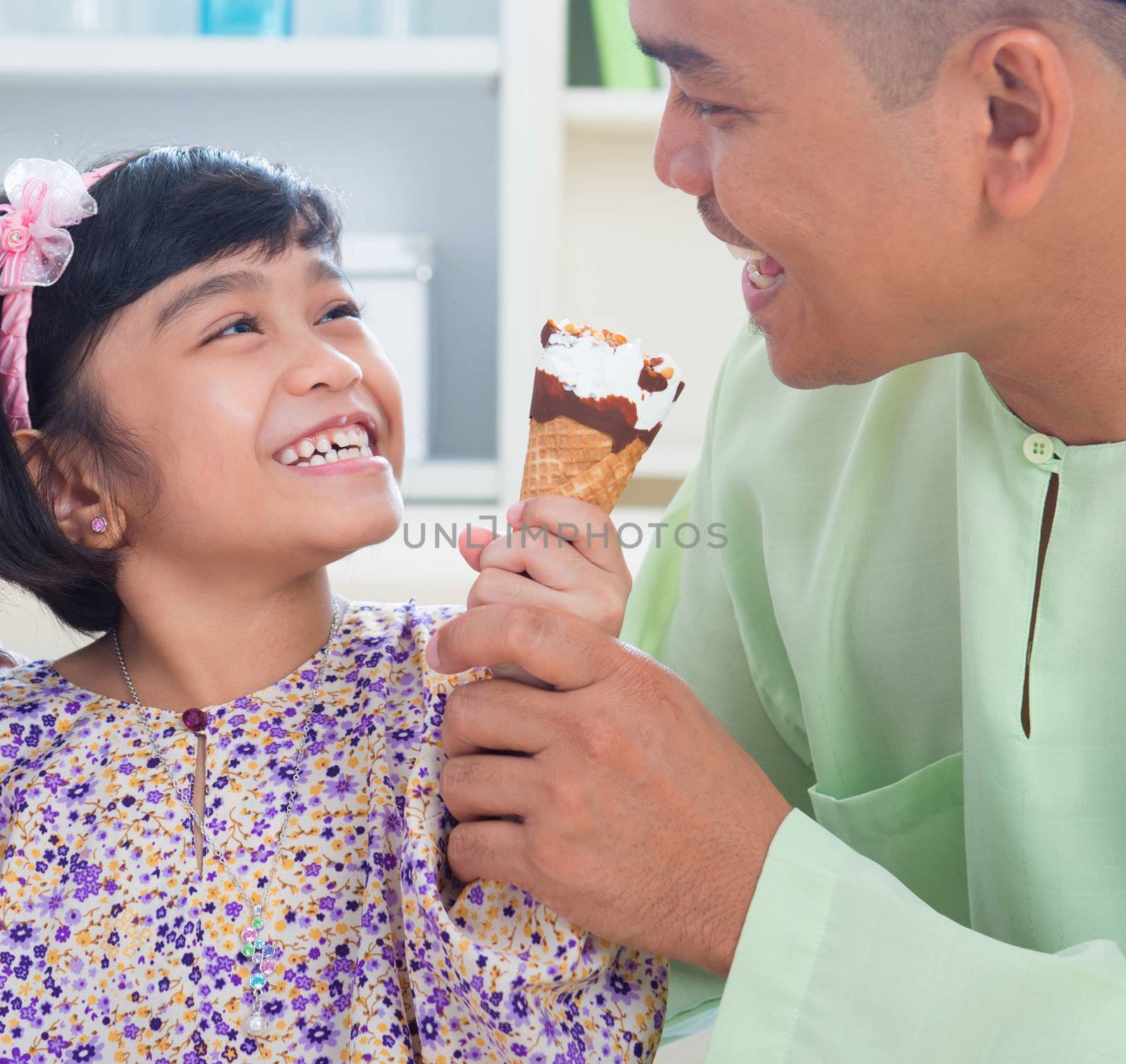 Southeast Asian family eat ice cream by szefei