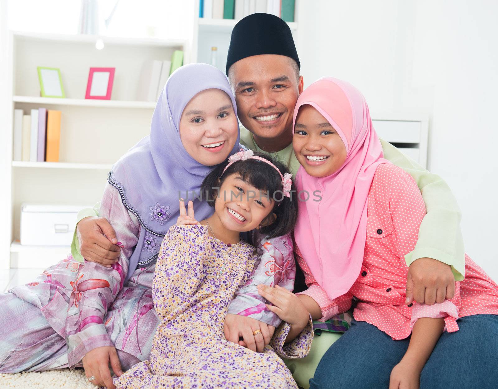 Southeast Asian family quality time at home. Muslim family living lifestyle.