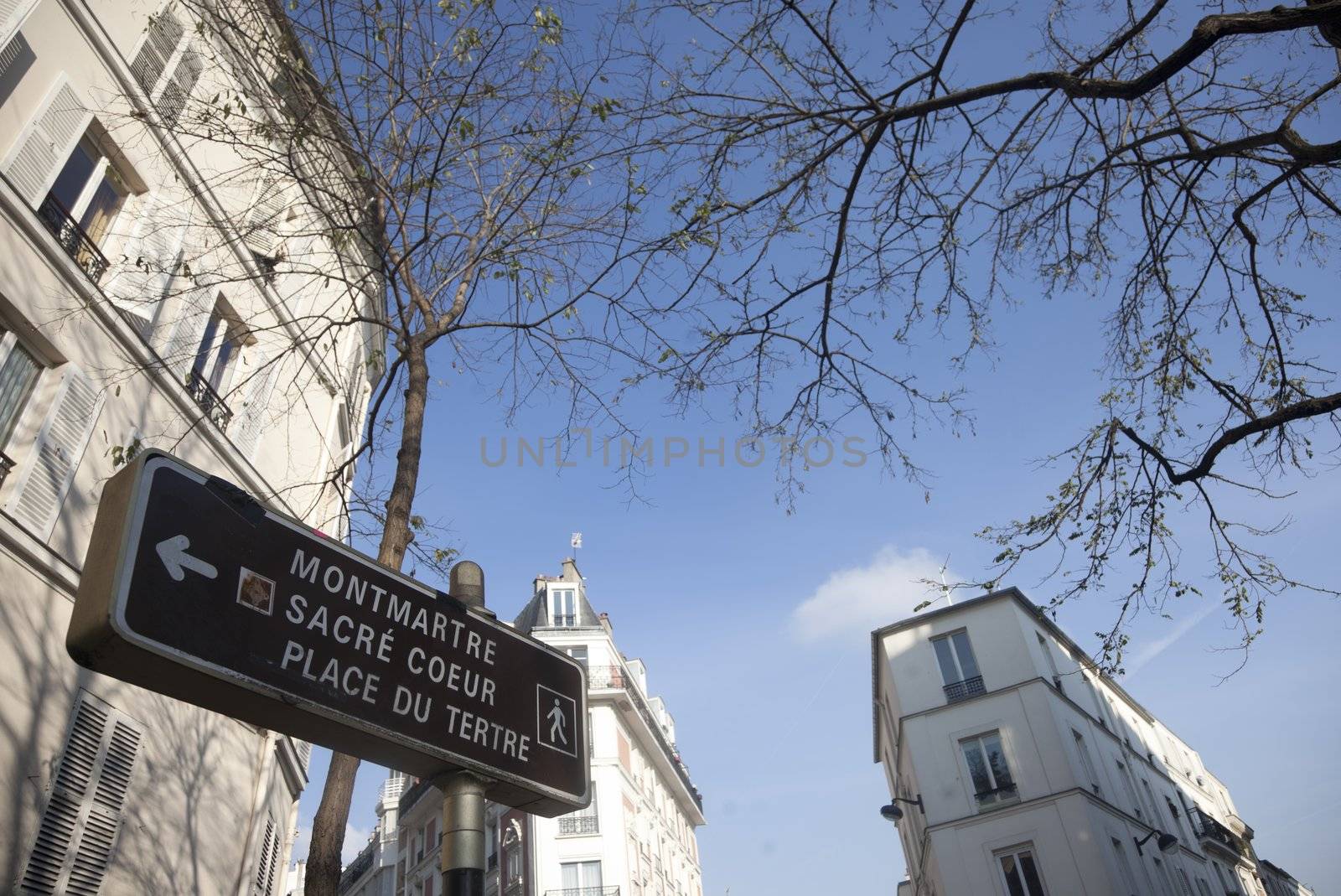 Sign board in Montmartre Paris showing the way up to Sacre Coeur