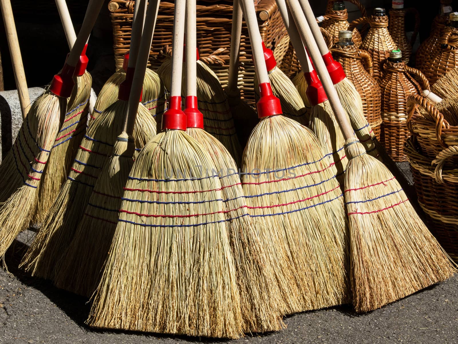 lot of hand made brooms