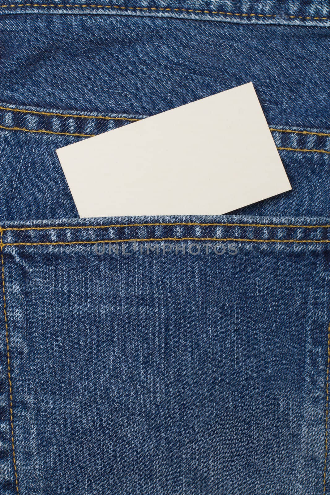 A denium blue jean pocket witn business card