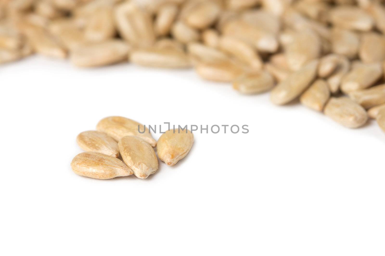 fresh sunflower seeds isolated on a white background