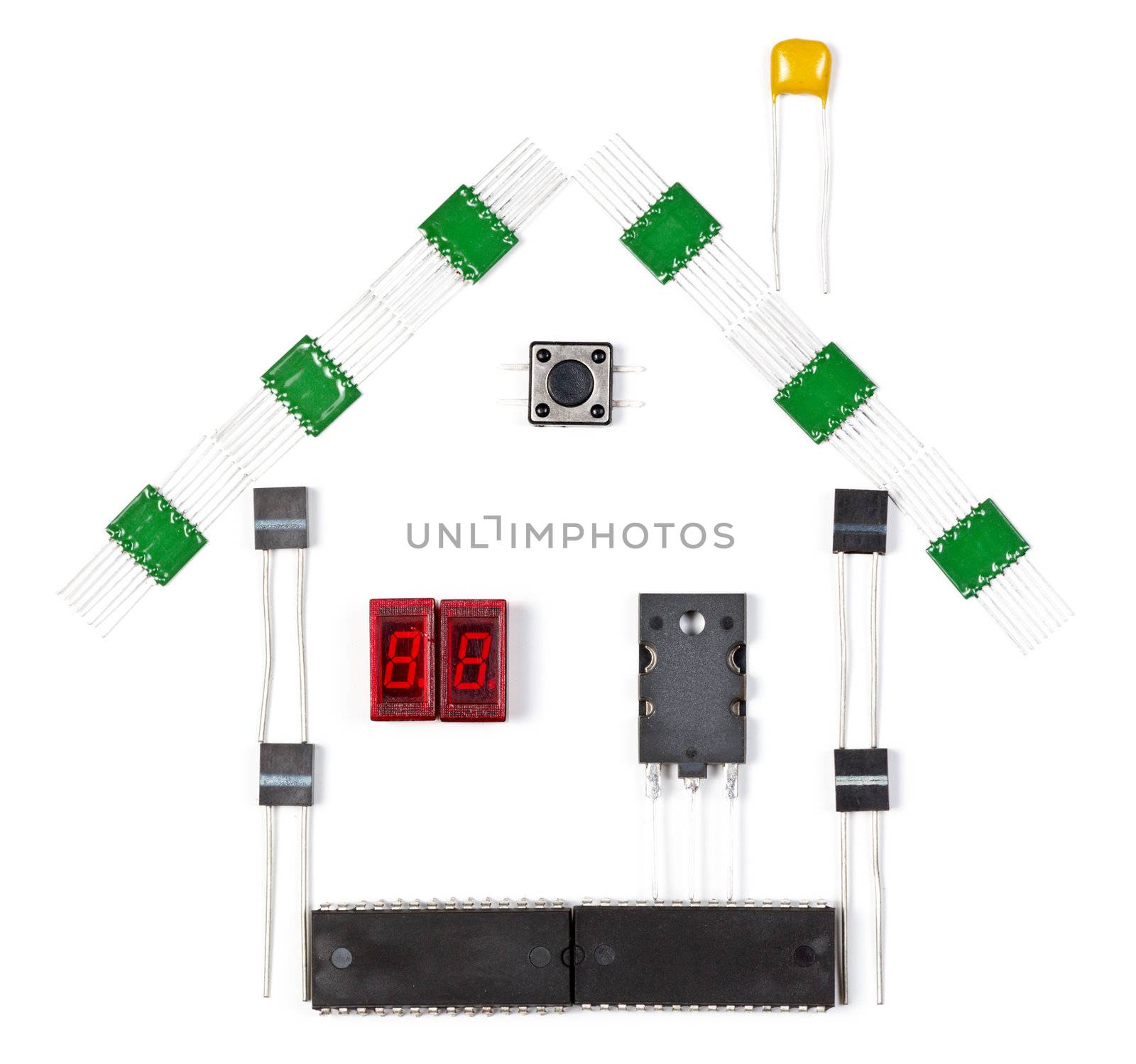 House made of electronic components on white background