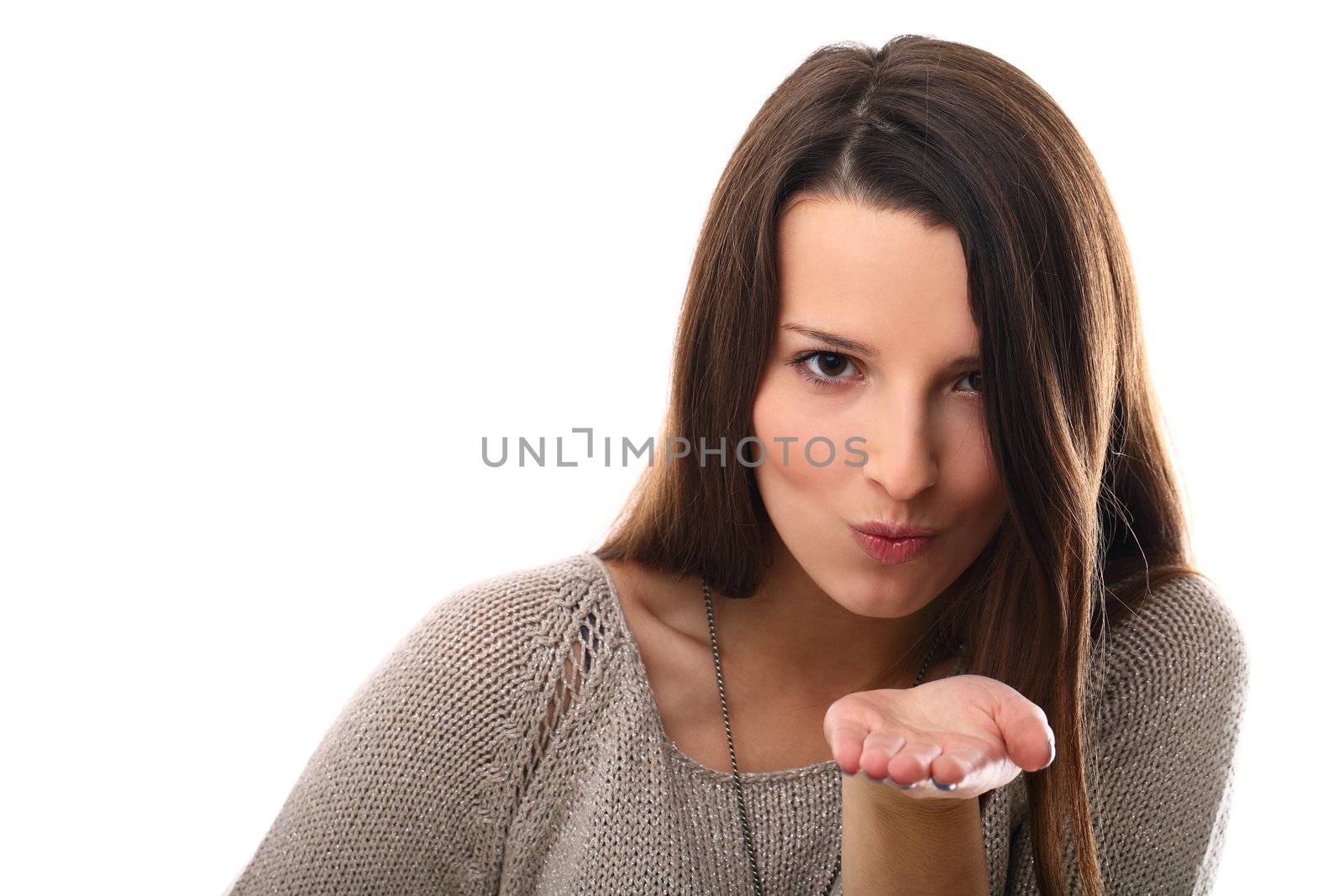 Beautiful girl sending air kiss isolated on a white background