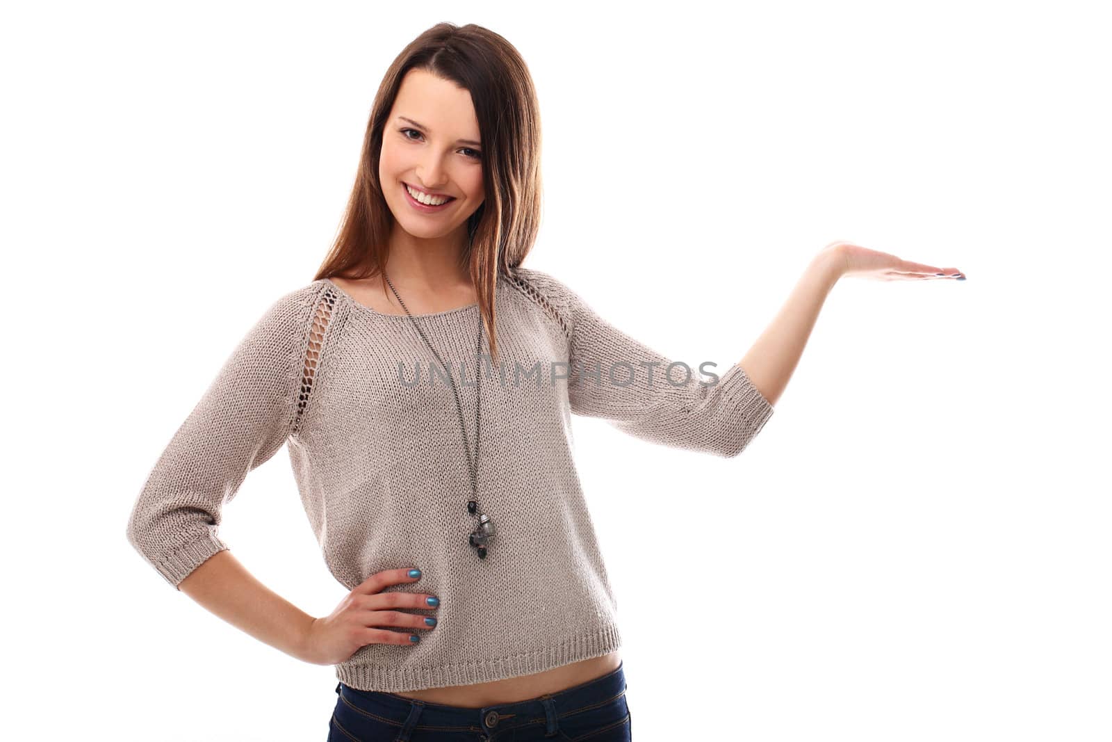 Beautiful girl posing with empty palm over a white background