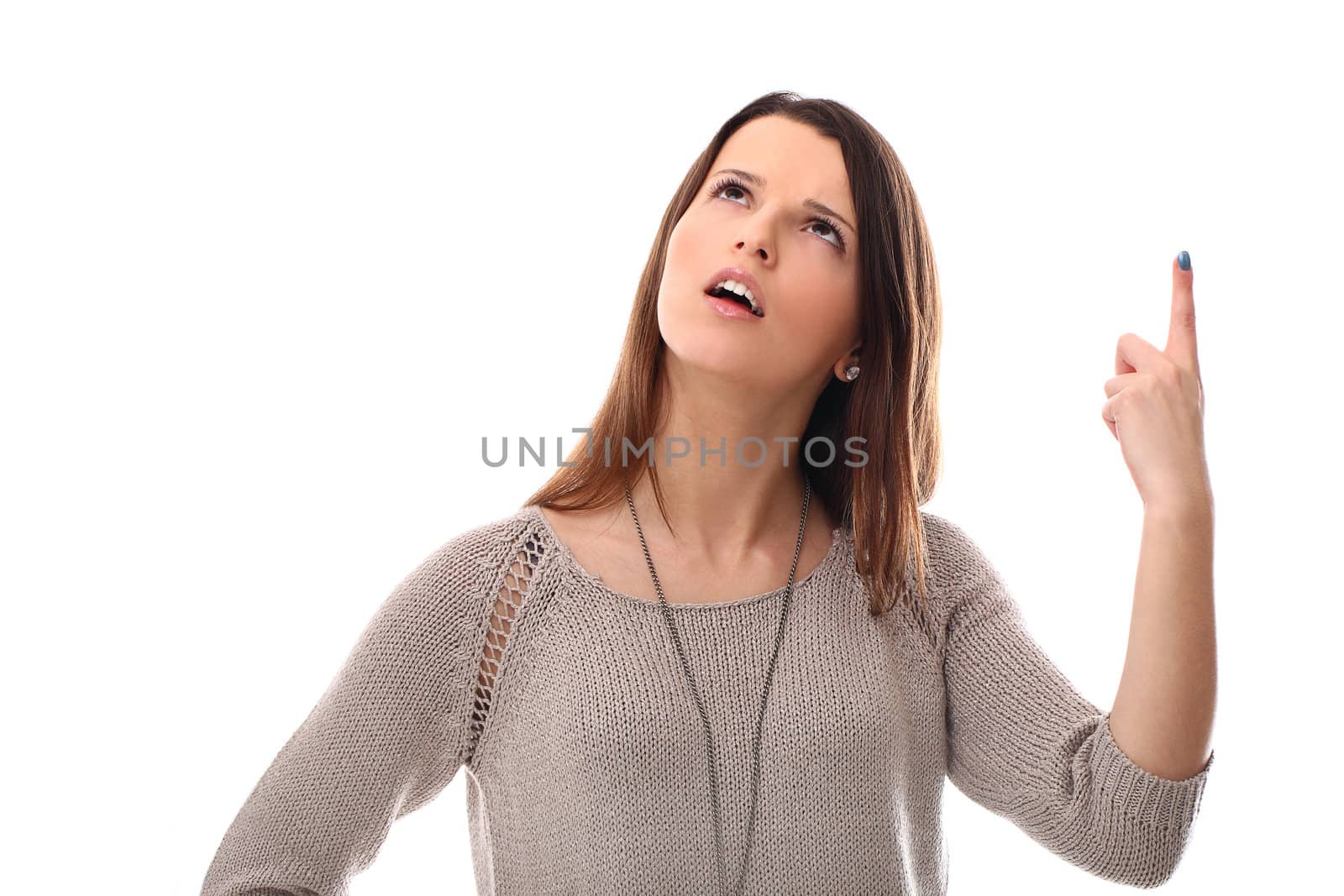 Pretty girl pointing at the sky isolated on a white background