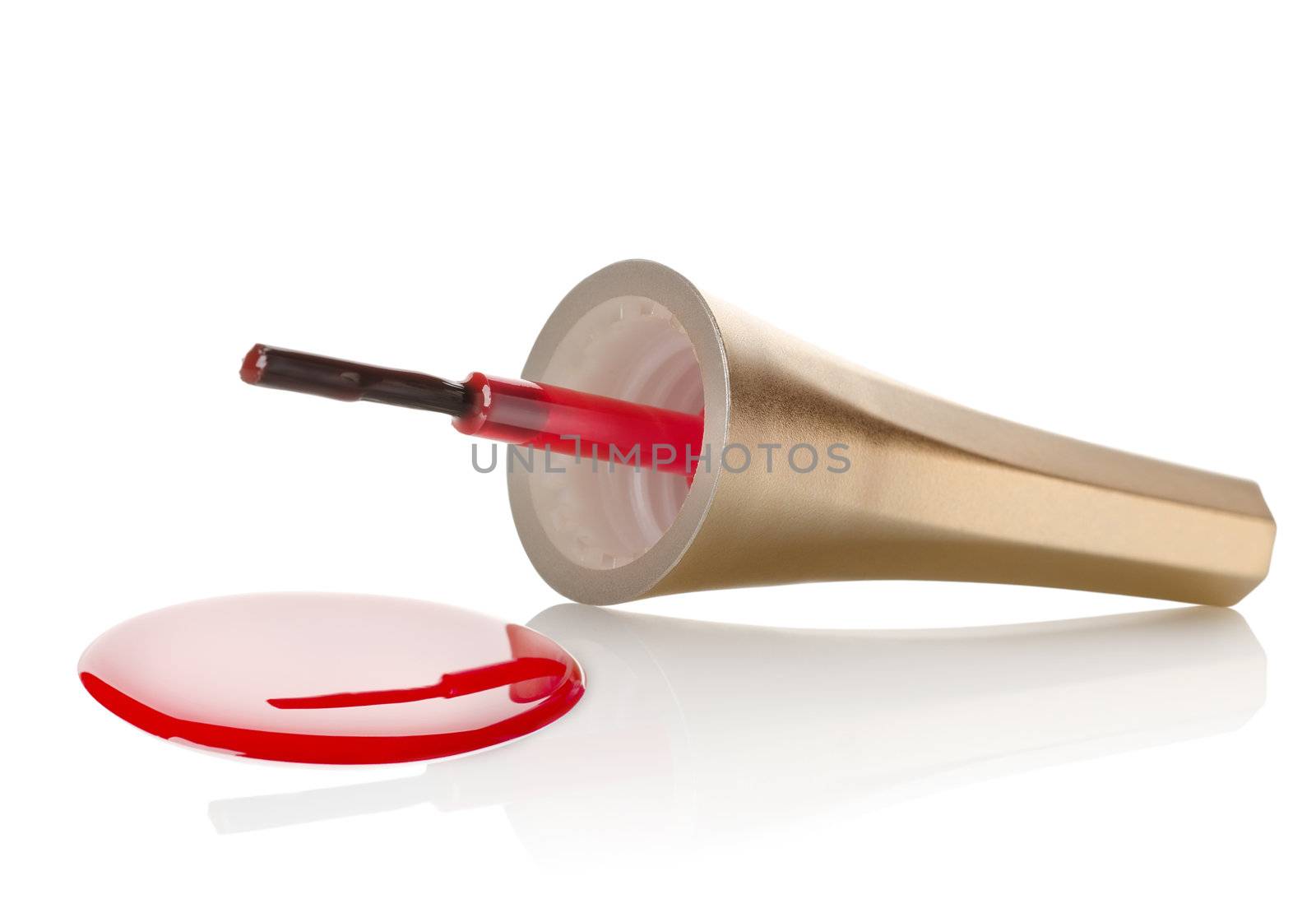 Red nail polish and brush isolated on a white background