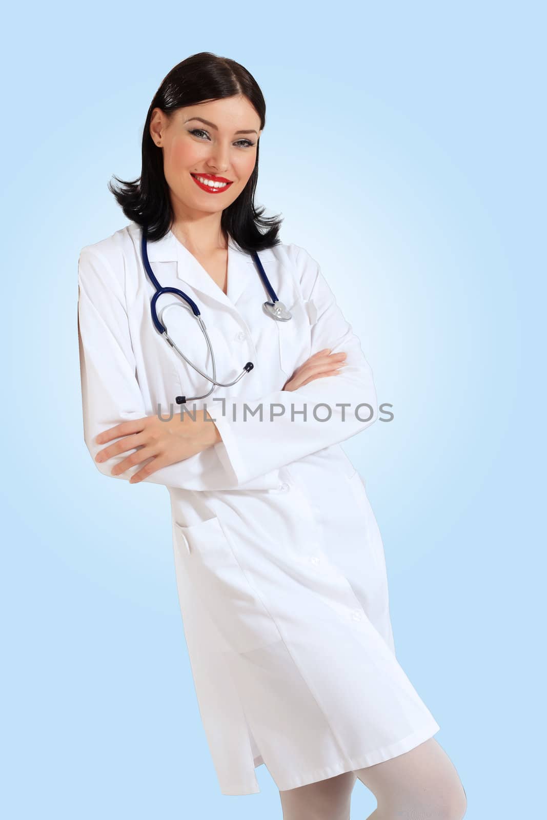 Portrait of happy successful young female doctor holding a stethoscope