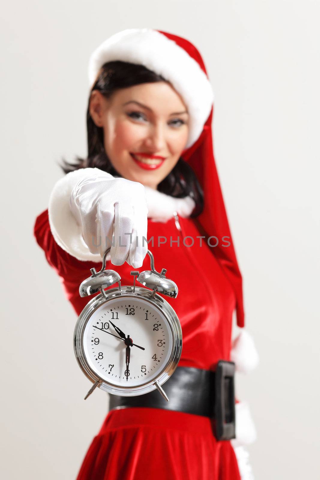 excited girl with santa hat holding clock. illustration