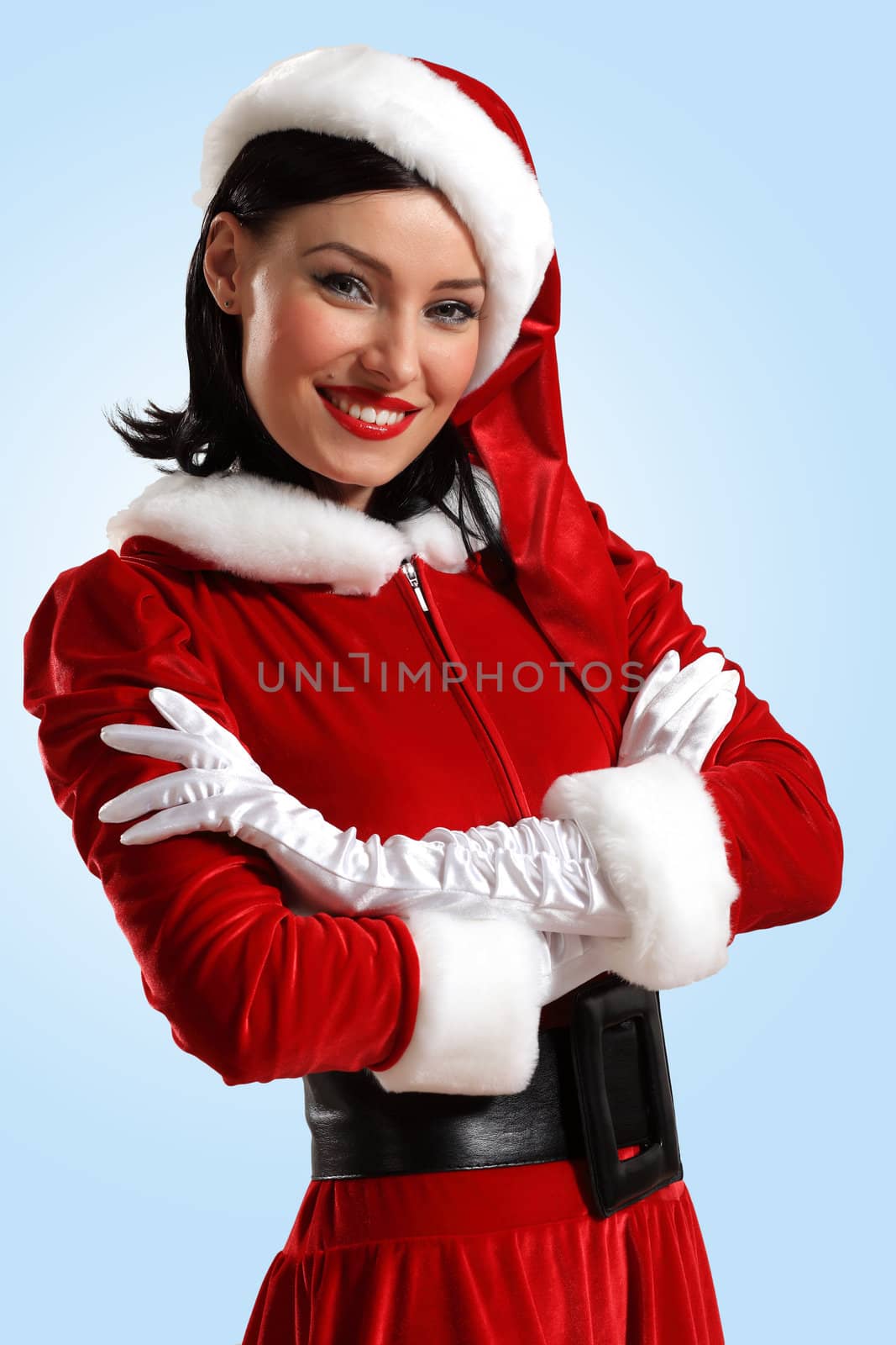 Portrait of beautiful young woman wearing santa claus clothes