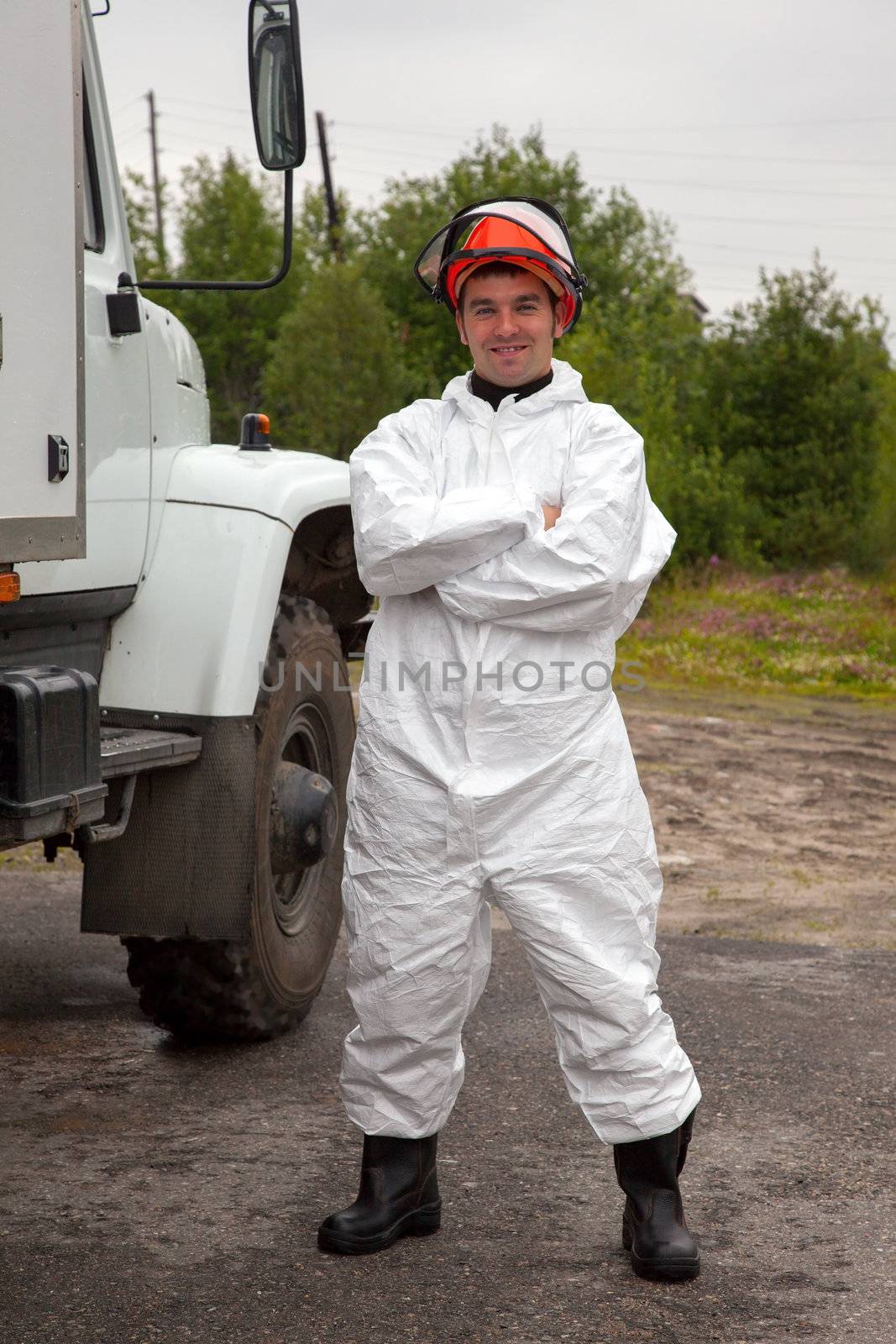 Nuclear plant worker in a white protective suit