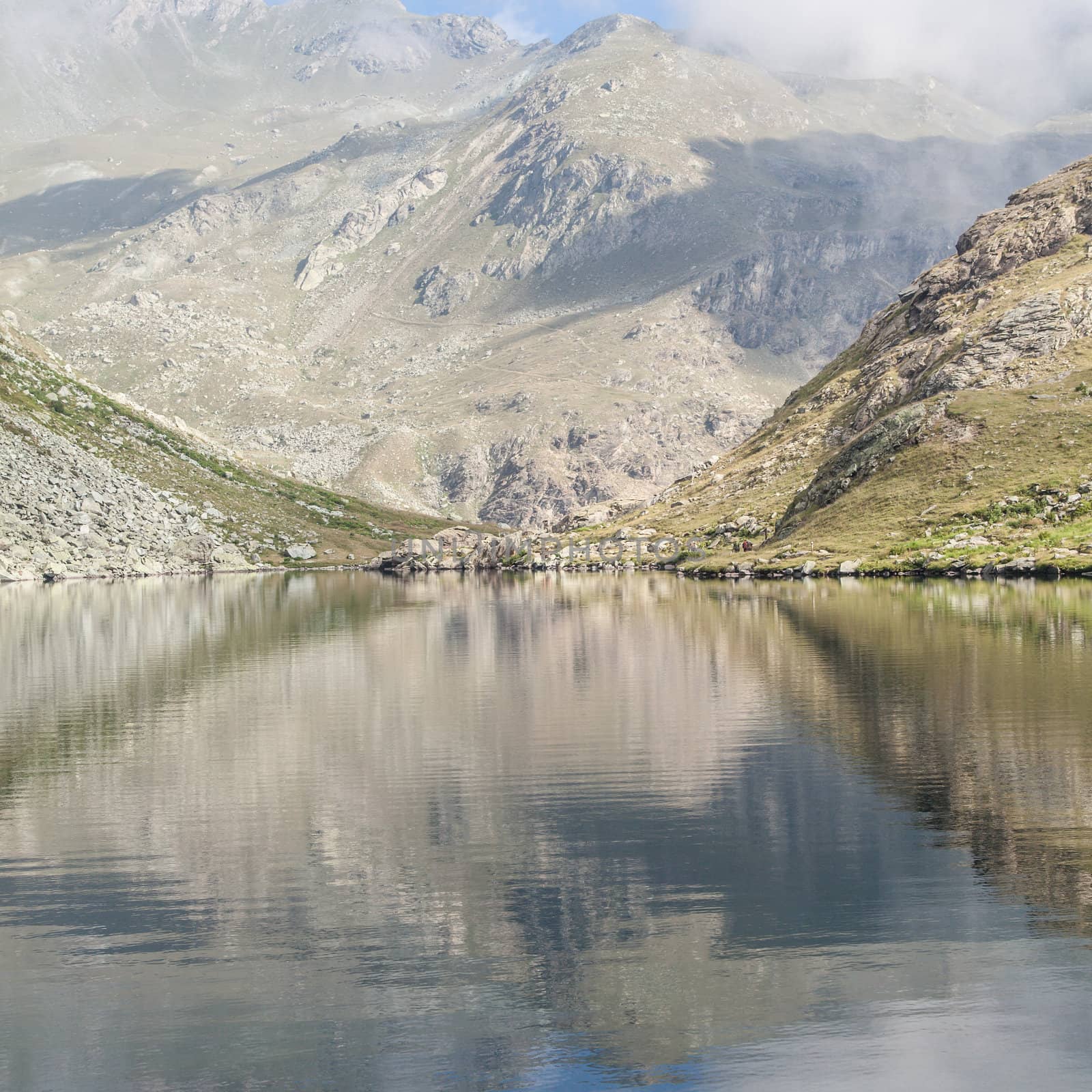 Alpine lake close to the path to the top of Monviso mountain, one of the most scenic mountain of Alps