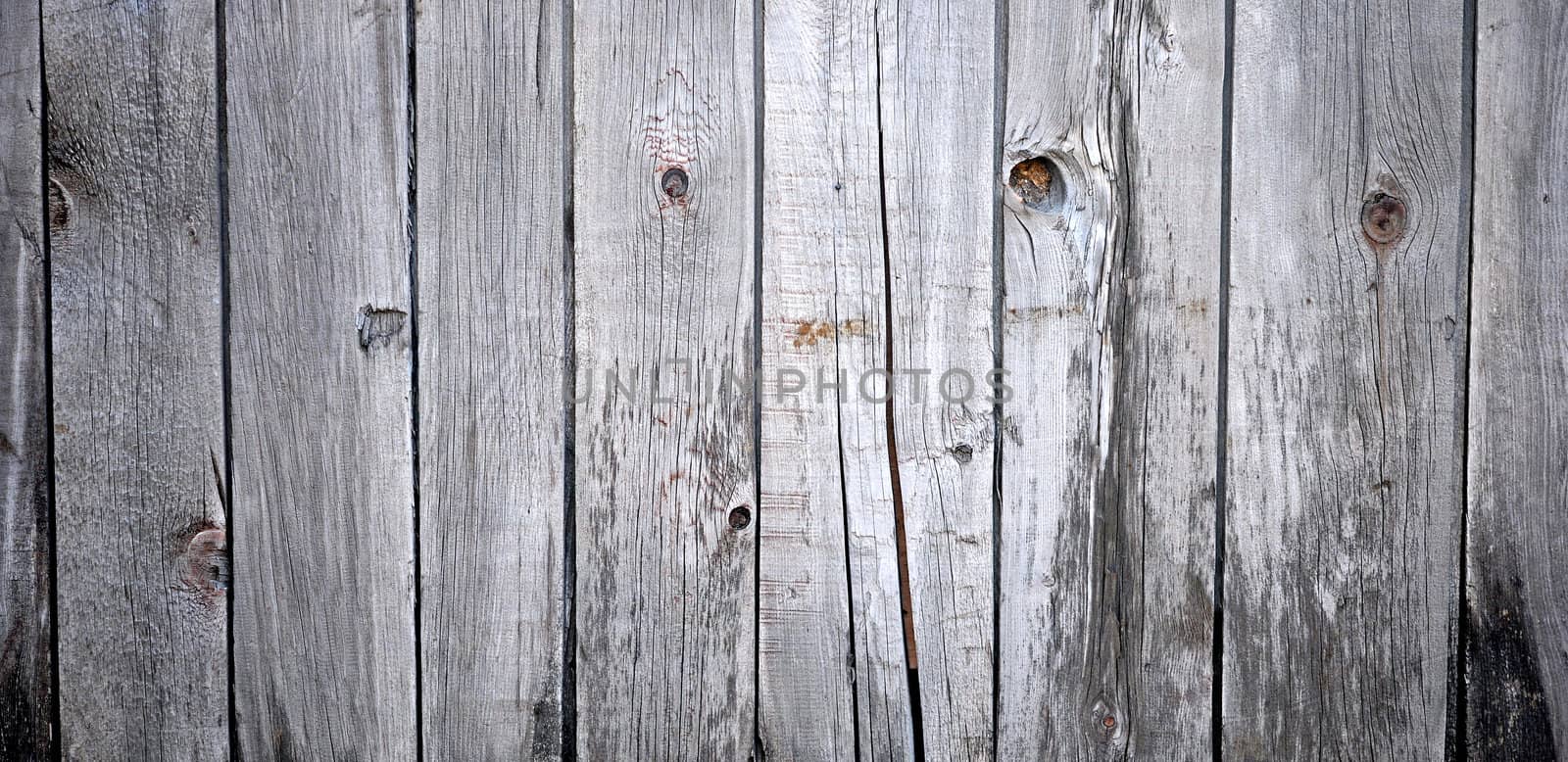 Close up of gray wooden fence panels 