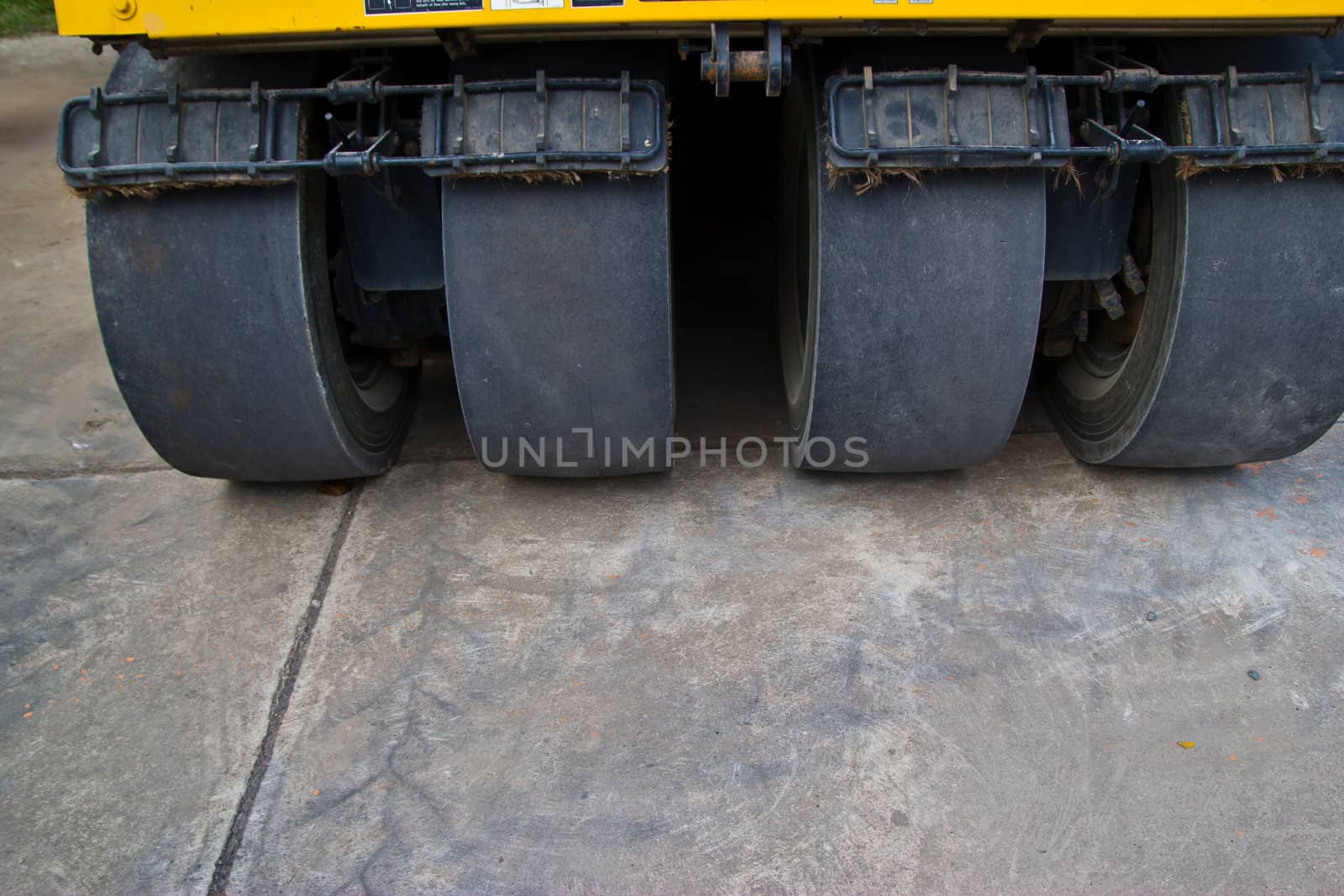 road roller at a road construction site  by wasan_gredpree