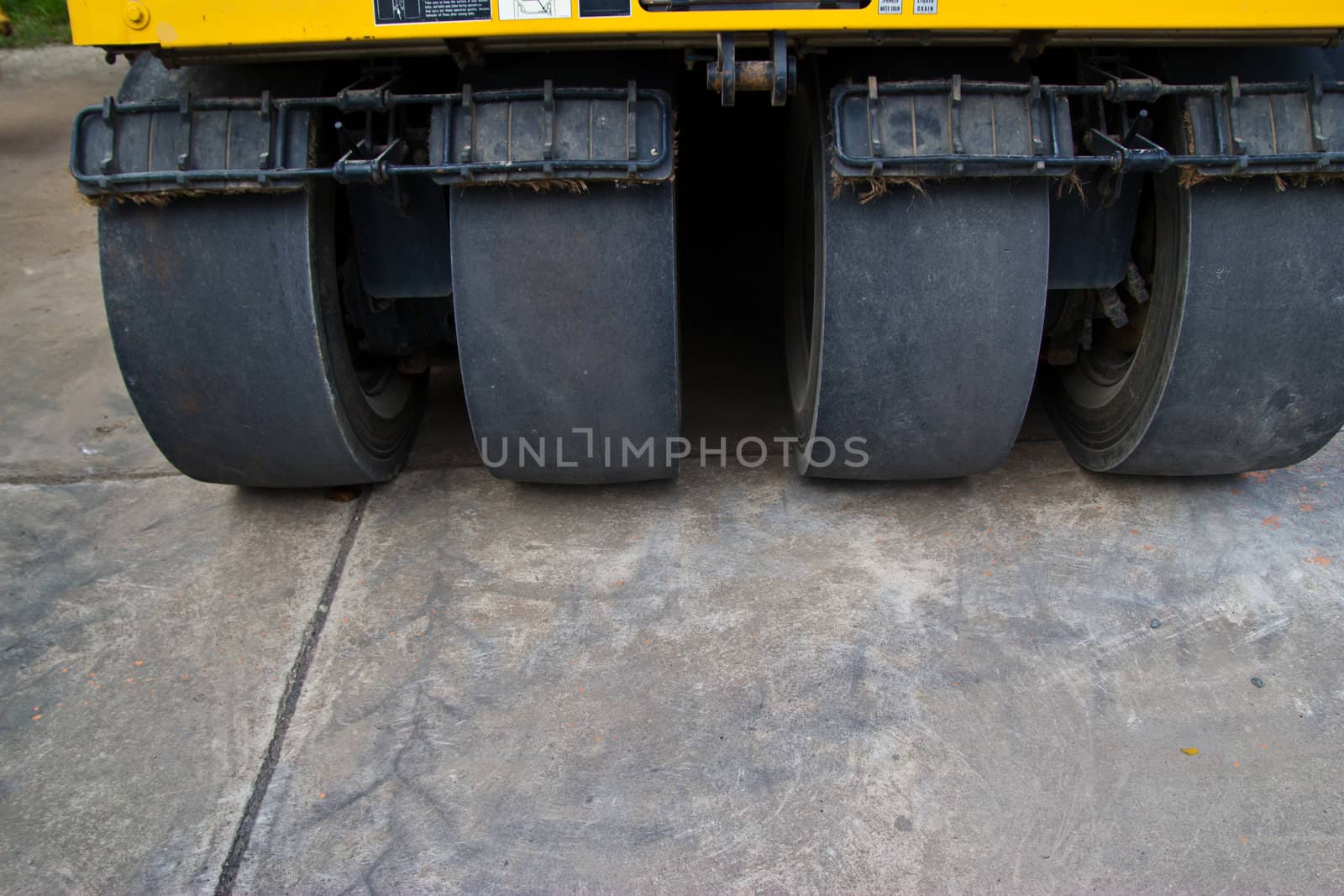 road roller at a road construction site  by wasan_gredpree