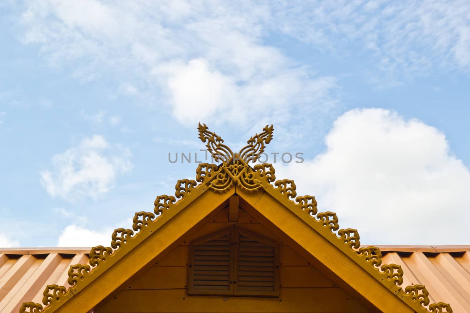 thai house roof an nice blue sky