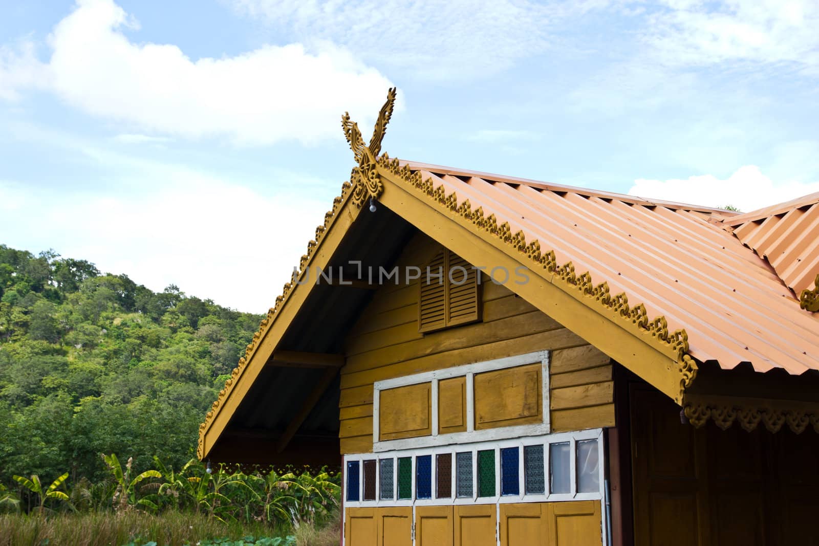 thai house roof an nice blue sky