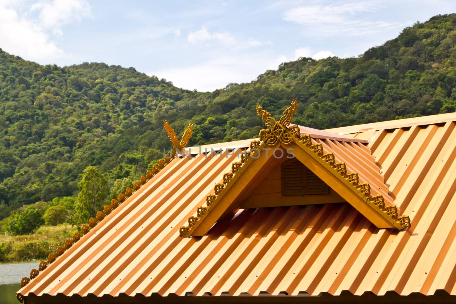 thai house roof an nice blue sky