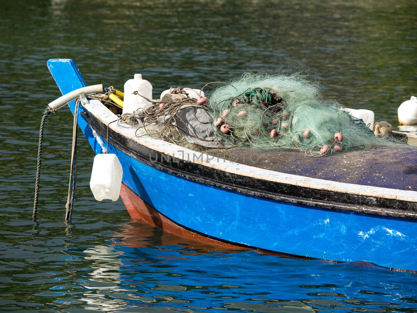  blue fishing boat on the sea