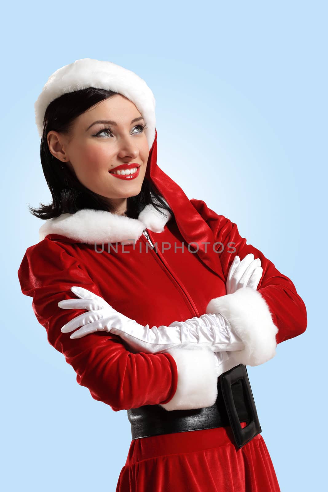 Portrait of beautiful young woman wearing santa claus clothes