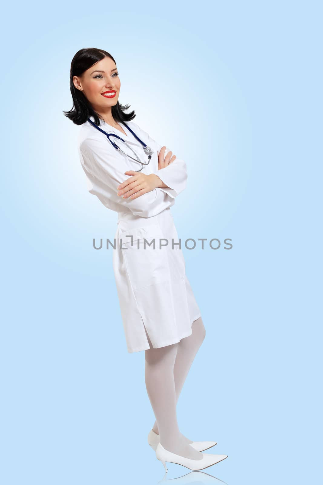 Portrait of happy successful young female doctor holding a stethoscope